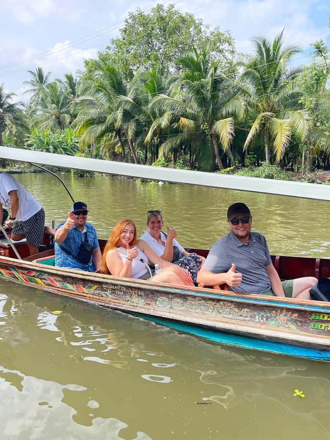 1-Day Trip: Floating Market & Railway Market by Toyota Camry - A canal ride through Damnoen Saduak