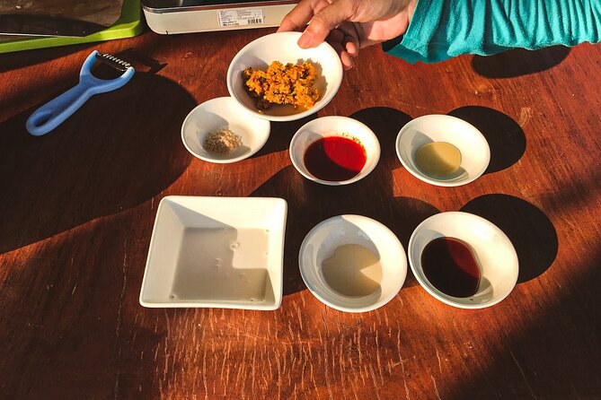 3-Hour Siem Reap Guided Cooking Class and Market with Pick up - Cooking with Dee in an open kitchen