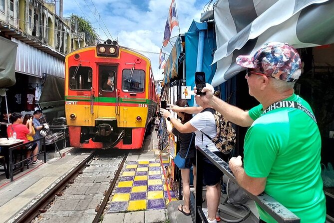 Amphawa and Railway Markets with Boat Ride Group Tour - Riding into Maeklong Railway Market