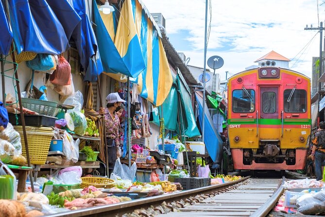 Amphawa Floating Market & Maeklong Railway Train Market Tour - Maeklong Railway Market: the train is part of the shopping