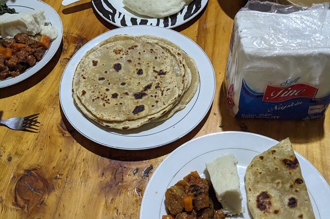 Arusha: Traditional Tanzania Cooking Class & Food Market Tour - Eating the meal you helped prepare