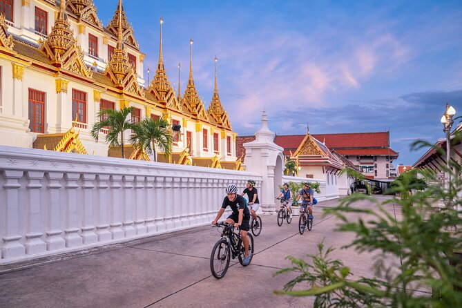 Bangkok: Night Bike Tour with Temples & Flower Market Visit - Starting through Bangkok’s Old City lanes