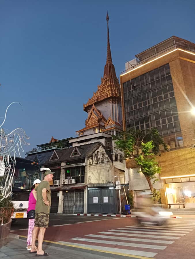 Bangkok Night Tuk Tuk: Private Tour of Markets & Landmarks - Wat Arun and the Grand Palace glow from outside