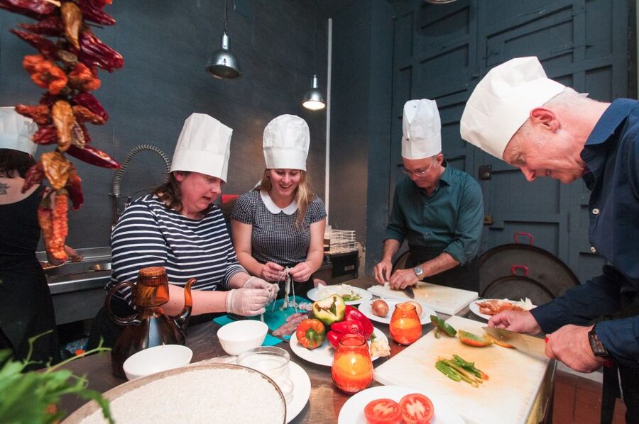 Barcelona: Paella Cooking Experience & Boqueria Market Tour - Building the seafood paella together