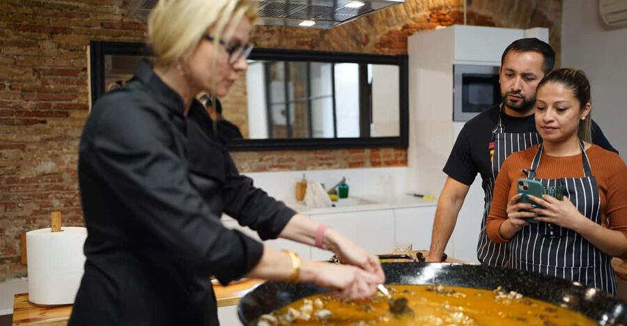 Barcelona: Seafood Paella Cooking Class & Boqueria market - Starting at La Boqueria with a red umbrella