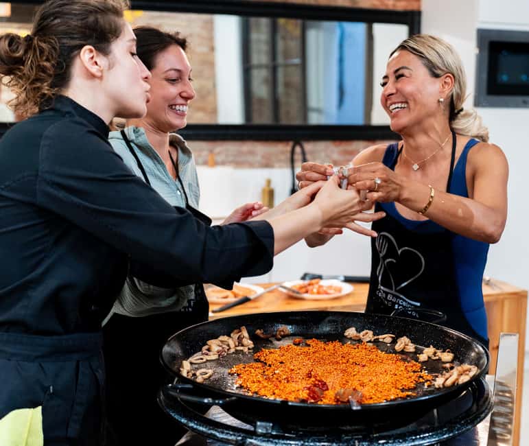 Barcelona: Seafood Paella Cooking Class & Boqueria market - Preparing paella with a local chef
