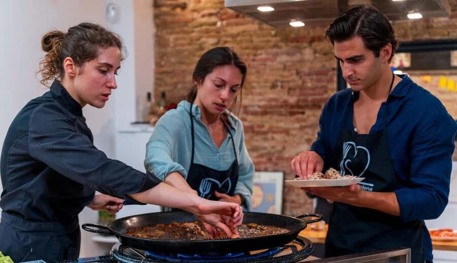 Barcelona: Seafood Paella Cooking Class & Boqueria market - Sitting down to the seafood meal