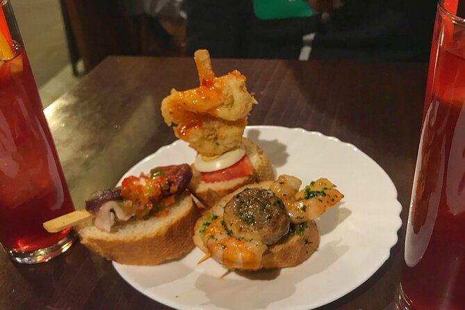 Barcelona Street Food Tour with Local Market & City Center Visit - Las Ramblas: Barcelona’s Famous Front Door
