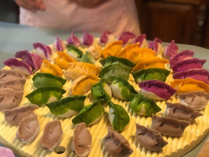 Beijing Market Tour with 10-course Family Feast - What makes the home setting valuable