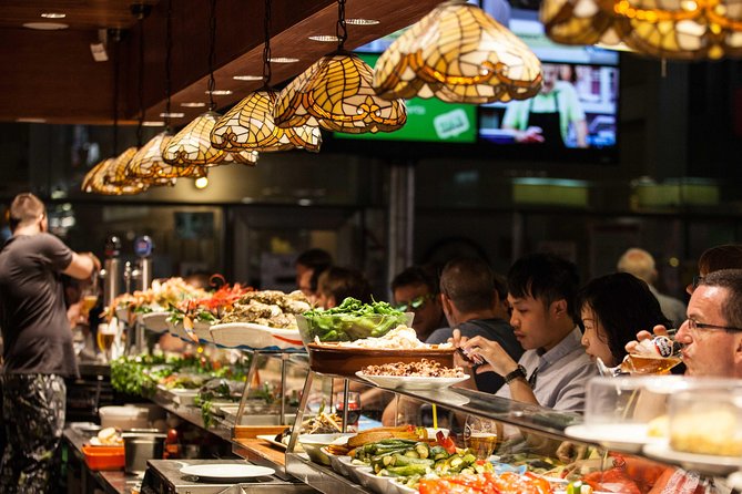 Boqueria & St Caterina Markets with Food & Tapas Small Group Tour - Starting at Plaça Reial and walking toward La Rambla