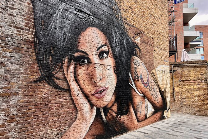 Camden Market Food Tour of 7 Tastings, Gin, Street Food & More - Cyberdog and the Amy Winehouse statue