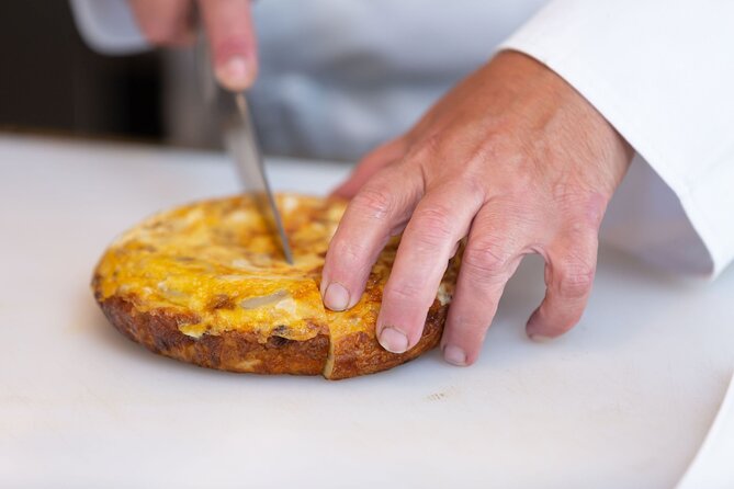 Cook Paella & Tapas + Market Tour in Barcelona (4-Course Meal) - Building saffron paella with seafood or vegetables