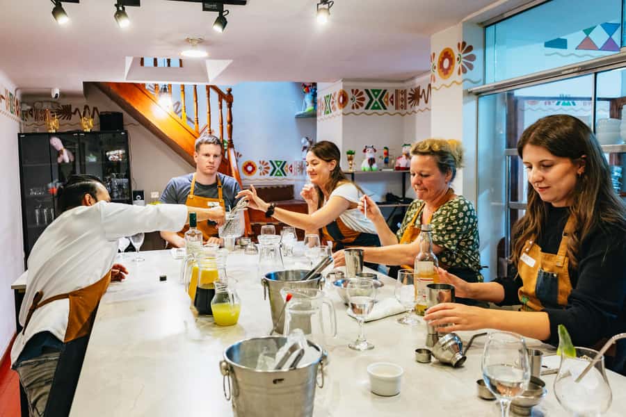 Cusco: Peruvian Cooking Class, Cocktails & Local Market Tour - Ending with picarones and honey