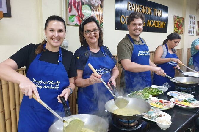 Customizable Thai Cooking Class with Onnuch Market in Bangkok - Cooking indoors without Bangkok heat