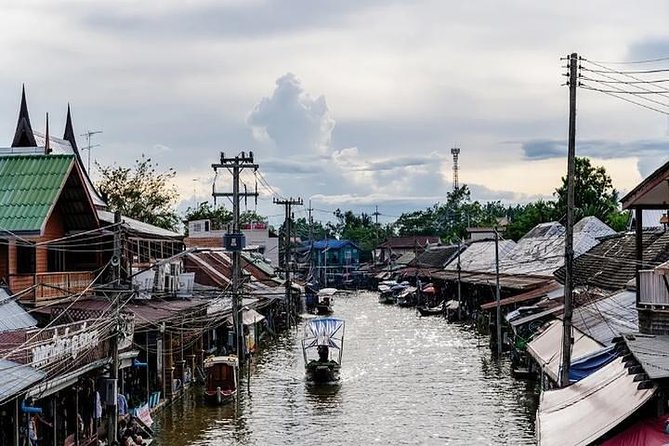 Damnoen Floating Market & Optional Erawan Water Waterfall Tour - Maeklong Railway Market and the moving tracks