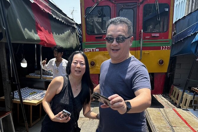 Damnoen Saduak Floating Market & Maeklong Railway From Bangkok - Watching the train pass through Maeklong