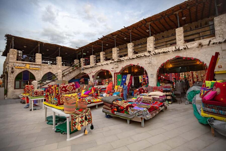 Doha: Souq Waqif, Dhow Harbour, and Street Food Walking Tour - Souq Waqif: spices, pets, clothing, and falcons