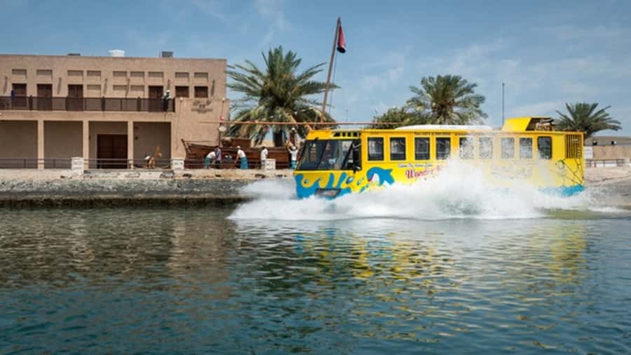 Dubai: Old town tour with Wonder Bus, souks, Creek and Guide - Textile Market, Heritage Village, and the old waterfront