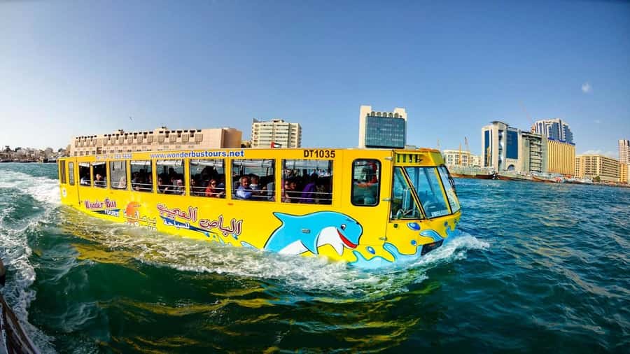 Dubai: Old town tour with Wonder Bus, souks, Creek and Guide - Souks, boats, and Dubai’s trading story