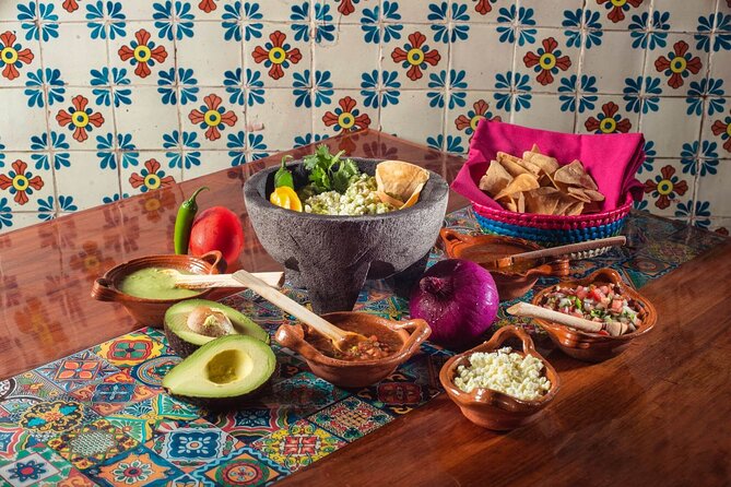 Flavors of Mexico: Cancun Cooking Class & Market Visit - Making guacamole in a molcajete
