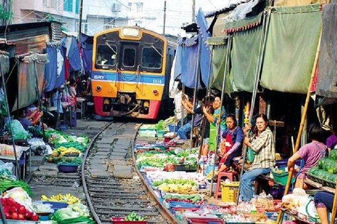 Floating Market Damnoen Saduak and Meklong Railway Market: Half Day Tour - Price, transport, and what the $120.81 buys