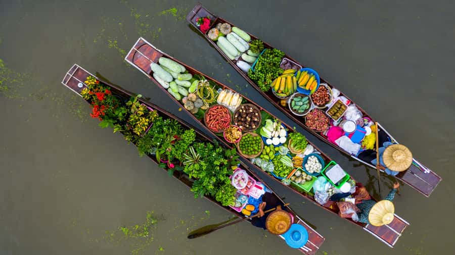 From Bangkok: Maeklong Railway and Floating Market Food Tour - Mae Klong Railway Market: the train comes first