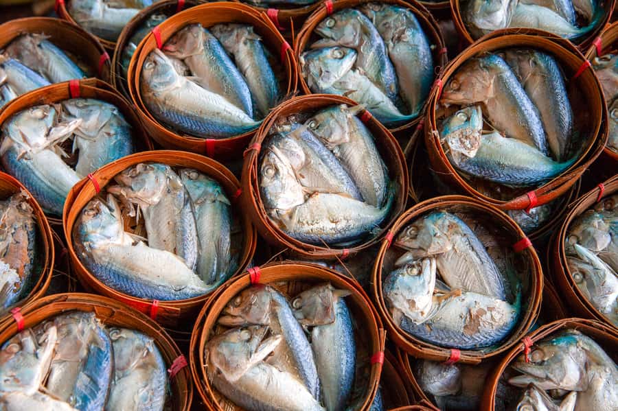 From Bangkok: Maeklong Railway and Floating Market Food Tour - The canal ride to Damnoen Saduak