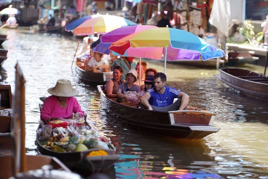 From Bangkok : Meklong Railway Market By Bus - Watching the train cut through Maeklong Market
