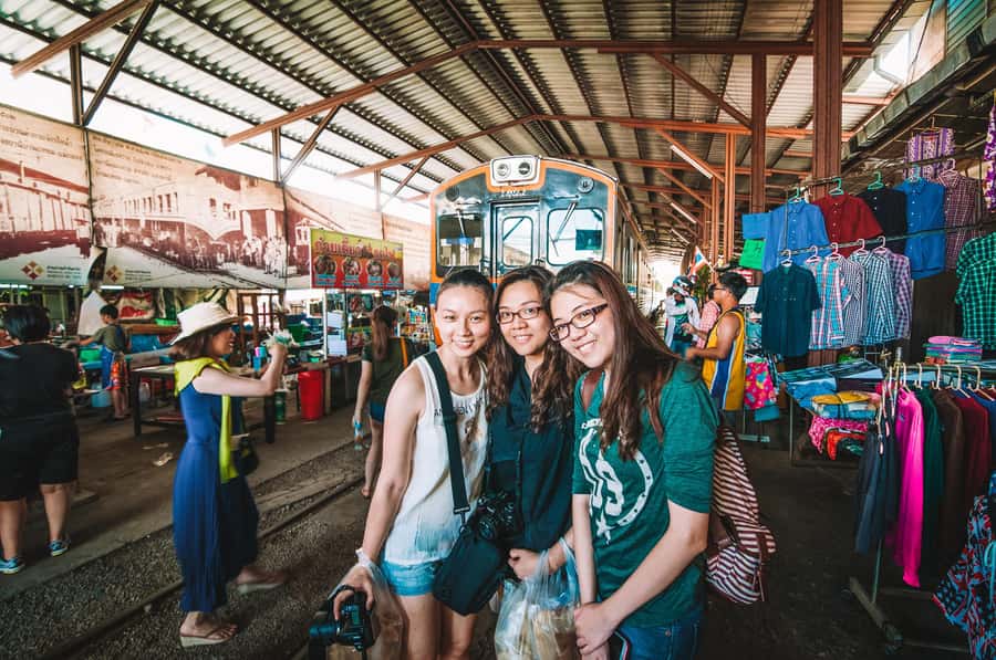 Grand Palace, Damnoen Floating Market & Maeklong Market Tour - Guides are the strongest part of the experience