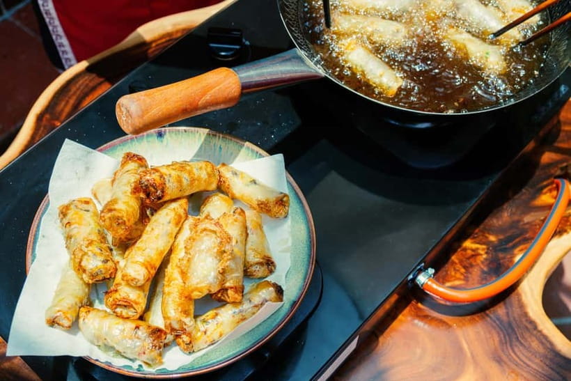 Hanoi Cooking Class: Market Tour, Free Recipe & Beverages - A villa setting with lunch at the end