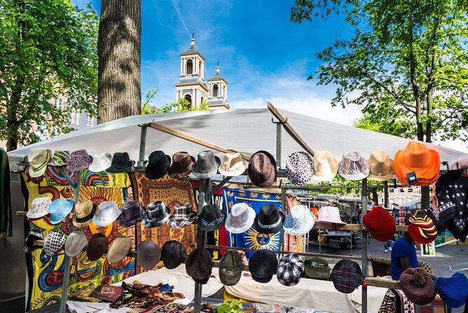 Historic Amsterdam Walking Tour: Royal Palace & Flea Markets - The Amstel River and Amsterdam’s defining views