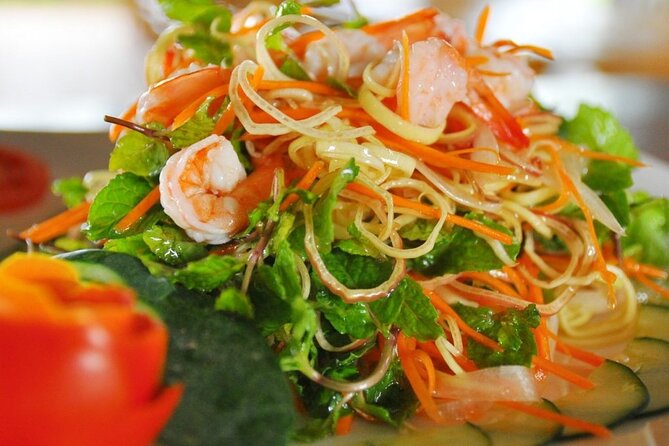 Hoi An Cooking Class With Market Tour and Bamboo Basket Boat Ride - Arriving at the garden restaurant near Tra Que