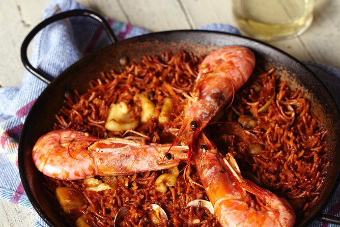 Interactive Paella & Market: Bottomless Wine & Rambla Views - Who should book this Barcelona cooking class?