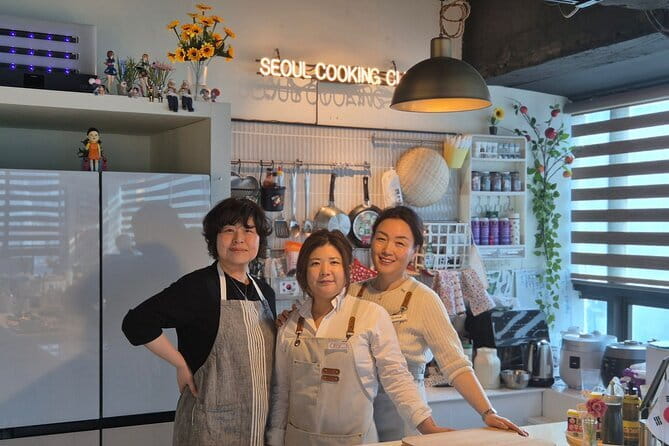 Korean Cooking Class with Grocery Shopping at Seoul Local Market - Cooking three Korean classics in a small studio