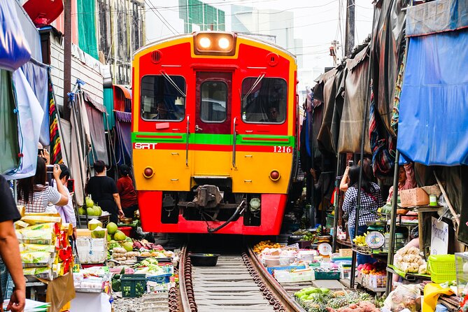 Maeklong Railway Market and Damnoen Saduak Floating Market Tour From Bangkok - Maeklong Railway Market and the train that cuts through it