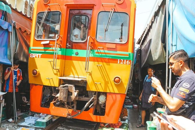 Maeklong Railway Market and Damnoen Saduak Floating Market Tour From Bangkok - Damnoen Saduak by long-tail boat