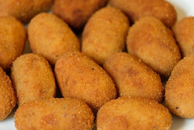 Malaga Market Food Tour: Tapas, Drinks, and Local Flavors - Plaza de la Merced and Andalusian tapas