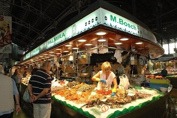 Market Gourmet Visit and Spanish Culinary Experience in Barcelona - Four courses, with paella at the center
