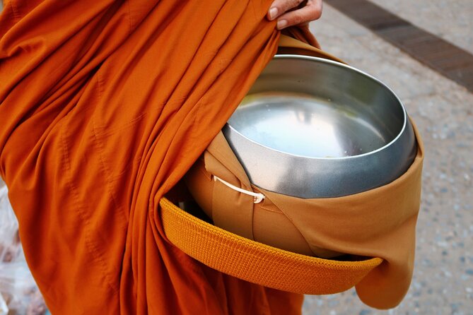 Morning Buddhist Almsgiving, Grand Palace and Flower Market Tour in Bangkok - Taking part in Buddhist almsgiving
