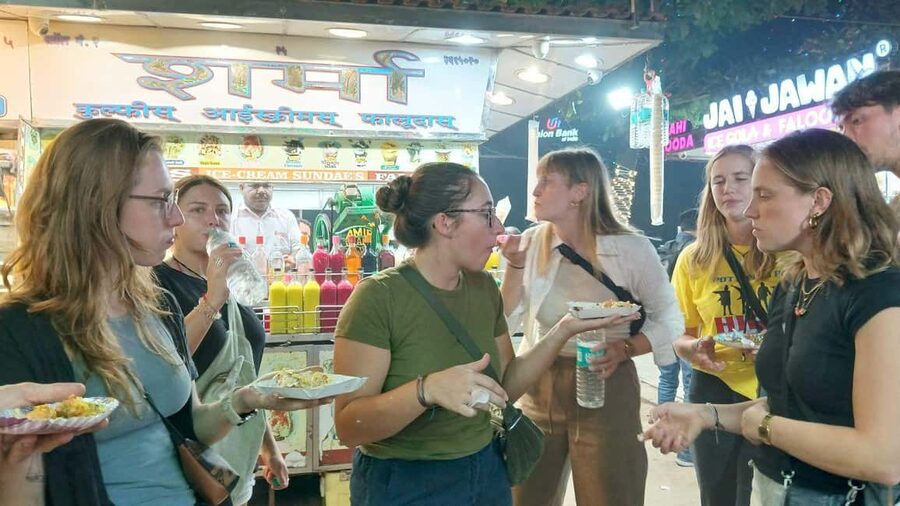 Mumbai Street Food Tour with Evening Bazaar Walk - Chowpatty Beach begins with a local train ride