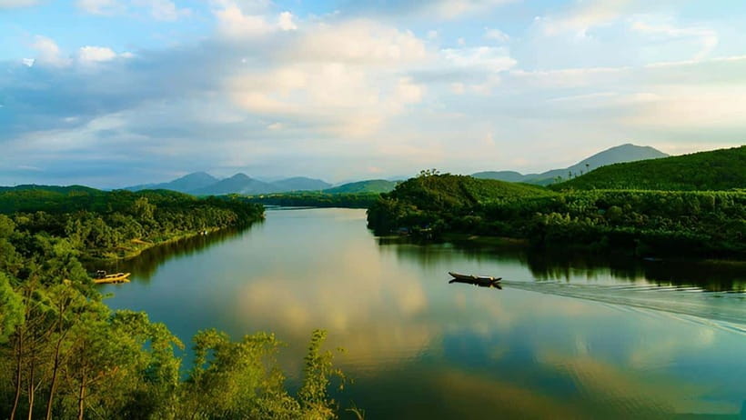 Official Hue: Dragon Boat, Imperial Citadel, & Market tour - Thien Mu Pagoda beside the river