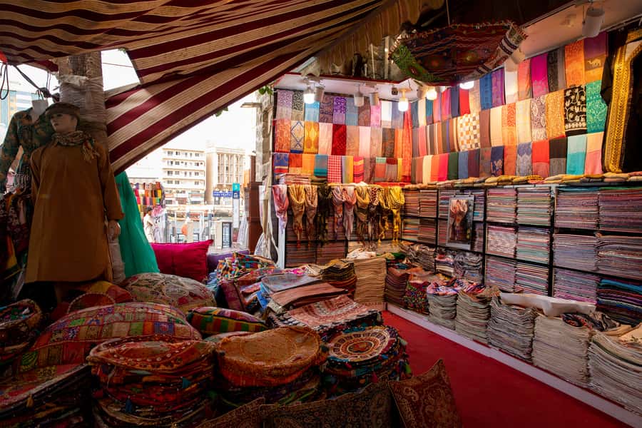 Old Dubai Historic Guided Tour: Creek, Street Food & Souks - Fort, souk, and the working side of Bur Dubai