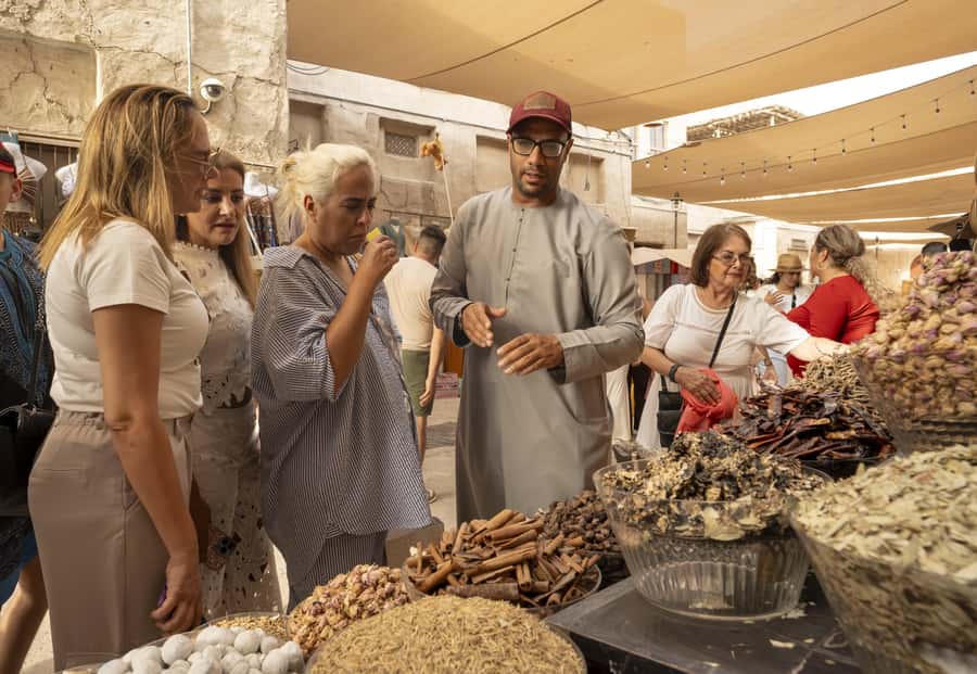 Old Dubai Historic Guided Tour: Creek, Street Food & Souks - Crossing Dubai Creek by traditional abra