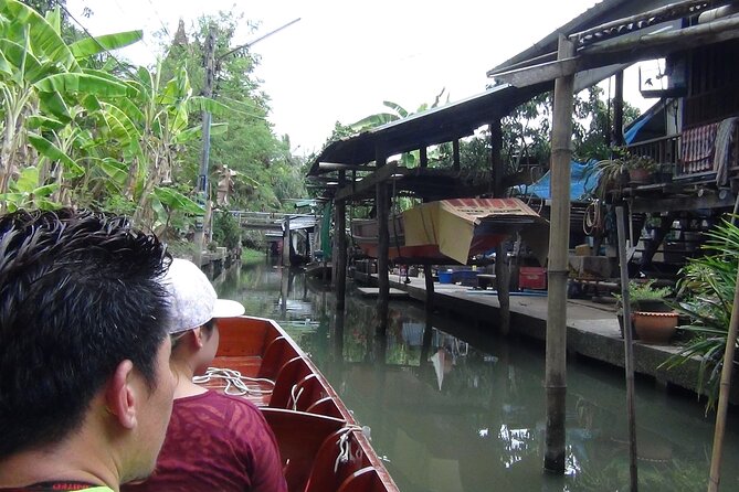 PRIVATE Floating Market + DRAGON Temple + DO like a Local - Mae Klong Railway Market: where the tracks become an aisle