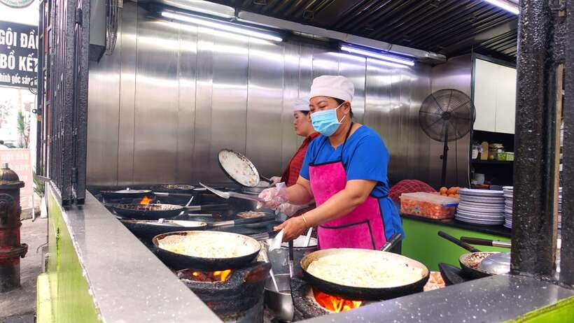 Saigon: Floating Market and Food Tasting Tour by Scooter - District 4 brings bánh mì and the night market