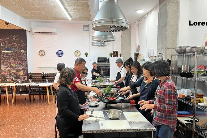 Seafood paella cooking class, tapas and visit to Ruzafa market. - Shopping through Mercado de Ruzafa