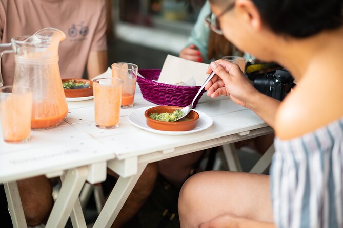 Seville Vegan Tapas Food and Market Walking Tour - Walking beside the Guadalquivir