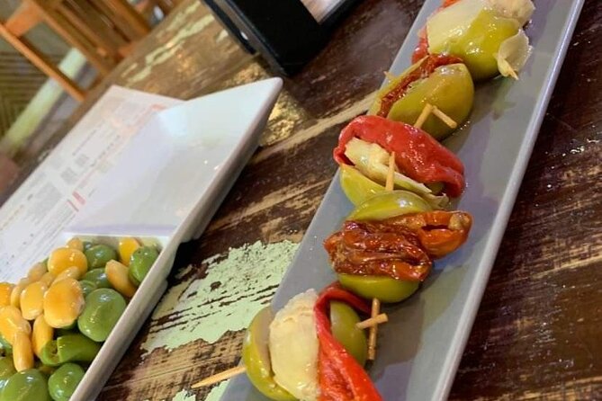 Seville Vegan Tapas Food and Market Walking Tour - Three to four vegan tapas stops in Triana