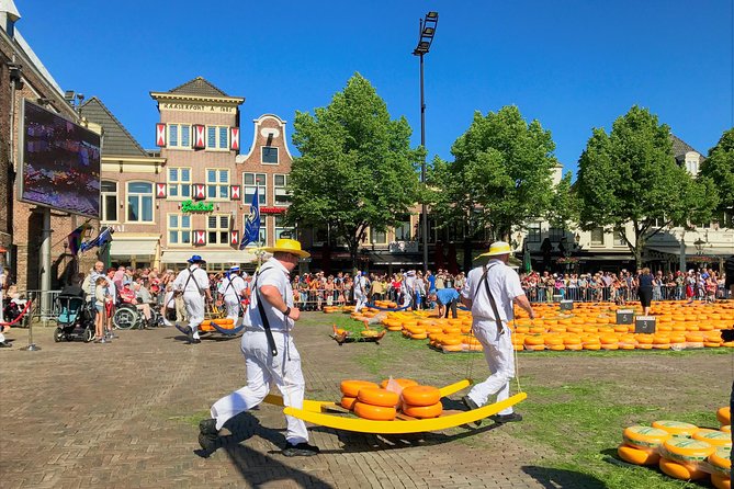 Small Group Alkmaar Cheese Market and City Tour <em>English</em> – Key points to know before booking’ /></p>
<ul>
<li><strong>Friday morning timing:</strong> Meet at 9:00 a.m. outside Alkmaar train station, then walk to the market.</li>
<li><strong>Small groups of six:</strong> The compact group makes it easier to ask questions and hear the guide without a headset.</li>
<li><strong>About 90 minutes at the market:</strong> You have time to watch cheese being weighed, traded, and carried.</li>
<li><strong>Personal access can vary:</strong> Jennifer has secured close or prime viewing places and introductions to cheese carriers, but exact access depends on crowd conditions.</li>
<li><strong>Cheese tasting is included in the experience:</strong> You can sample Dutch cheese, while extra purchases are your responsibility.</li>
<li><strong>Easy city-center finish:</strong> The tour ends at Waagplein, leaving you in central Alkmaar with the rest of the day free.</li>
</ul>
<h2>Why Alkmaar’s cheese market is worth the morning</h2>
<p>English</em> – Why Alkmaar’s cheese market is worth the morning’ /></p>
<p><p>Alkmaar’s cheese market is not simply a row of stalls selling Gouda. It is a public show built around an old trading system. Large wheels are carried by members of the Cheese Carriers Guild, weighed at the Waag, and moved across the square in a practiced routine.</p>
</p>
<p><p>That routine can be hard to understand if you arrive alone. You may see men in traditional clothing carrying cheese and wonder what each movement means. Jennifer’s explanation gives the action a clear order. You learn how the cheese is handled, why the Weigh House matters, and how the market connects to Alkmaar’s past.</p>
</p>
<p><p>The tour spends about 1.5 hours at the market. That is a useful amount of time. You are not rushed through after one photo, but you also are not tied up there for half the day. The guide can point out the important moments, explain the work of the carriers, and help you find a sensible place to watch.</p>
</p>
<p><p>Several people who took the tour were especially pleased with the close views. Jennifer has used her relationships with local cheese carriers to secure spots inside the gates or near the action on some mornings. In a small group, that kind of positioning matters. You can hear more, see the weighing process better, and possibly speak with a carrier.</p>
</p>
<p><p>Still, treat close access as a welcome possibility, not a guaranteed private performance. The market can draw large crowds, and conditions can change. Even from outside the gates, the guide’s commentary gives the scene much more meaning.</p>
</p>
<div class="twil" style="margin: 20px 0; padding: 15px 0;"><p>A few more market tours around the world worth a look</p><ul style="margin: 10px 0; padding-left: 0; list-style: none;"><li style="margin: 0 0 12px 0; padding: 0 0 12px 0; border-bottom: 1px solid #FBE7E2; line-height: 1.4;"><a href="https://markettourer.com/basel-farmers-market-cheese-chocolate-pastry-tour/">Basel Farmer’s Market, Cheese, Chocolate & Pastry Tour</a><br><span style="font-size: 0.82em; color: #555;"><span style="color: #E4572E;">★</span> 4.5 &nbsp;&middot;&nbsp; 171 reviews</span></li><li style="margin: 0 0 12px 0; padding: 0 0 12px 0; border-bottom: 1px solid #FBE7E2; line-height: 1.4;"><a href="https://markettourer.com/basel-farmers-market-cheese-chocolate-pastry-tour-2/">Basel: Farmer’s Market, Cheese, Chocolate & Pastry Tour</a><br><span style="font-size: 0.82em; color: #555;"><span style="color: #E4572E;">★</span> 4.0 &nbsp;&middot;&nbsp; 18 reviews</span></li><li style="margin: 0; padding: 0; border-bottom: none; line-height: 1.4;"><a href="https://markettourer.com/amsterdam-traditional-cheese-market-tour-to-alkmaar/">Amsterdam: Traditional Cheese Market Tour to Alkmaar</a><br><span style="font-size: 0.82em; color: #555;"><span style="color: #E4572E;">★</span> 4.2 &nbsp;&middot;&nbsp; 6 reviews</span></li></ul></div><h2>Meeting the guide outside Alkmaar station</h2>
<p><img width="669" height="446" decoding="async" src=