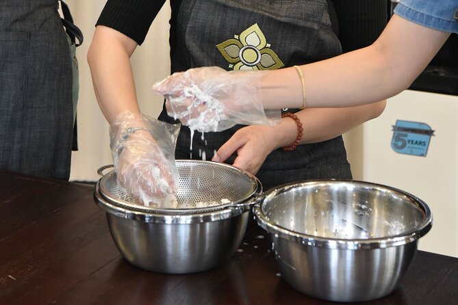 Thai Cooking Class with Market Tour in Sathon Bangkok - Making curry paste the traditional way